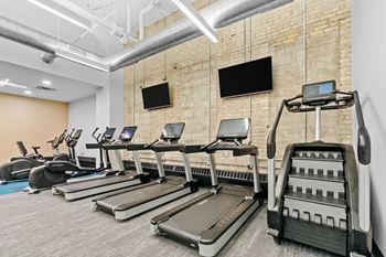 Fitness center with toning machines and treadmills
